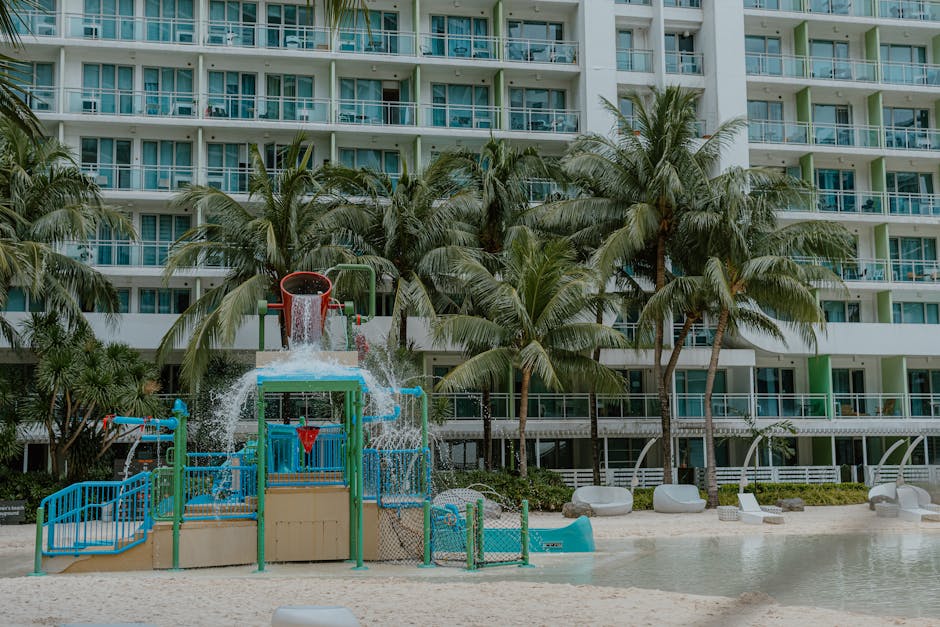 familotel sonnenpark - A vibrant children's water play area at a tropical resort surrounded by palm